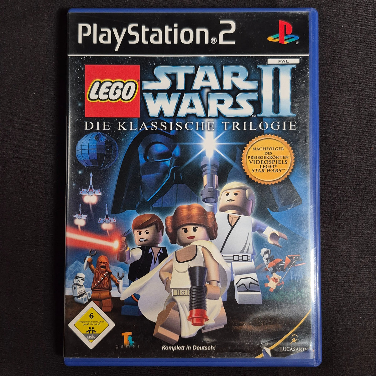 LEGO Star Wars II Die klassische Trilogie – PlayStation 2 – Deutsch – Zustand Gut – Vorderseite – NEVO Store